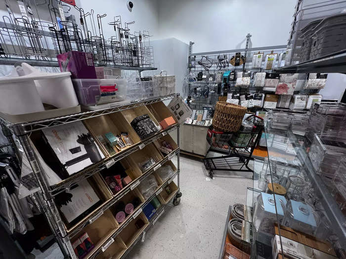 The one crowded area was in the bath section at the rear of the store, where several restocking carts had been shoved into a corner.