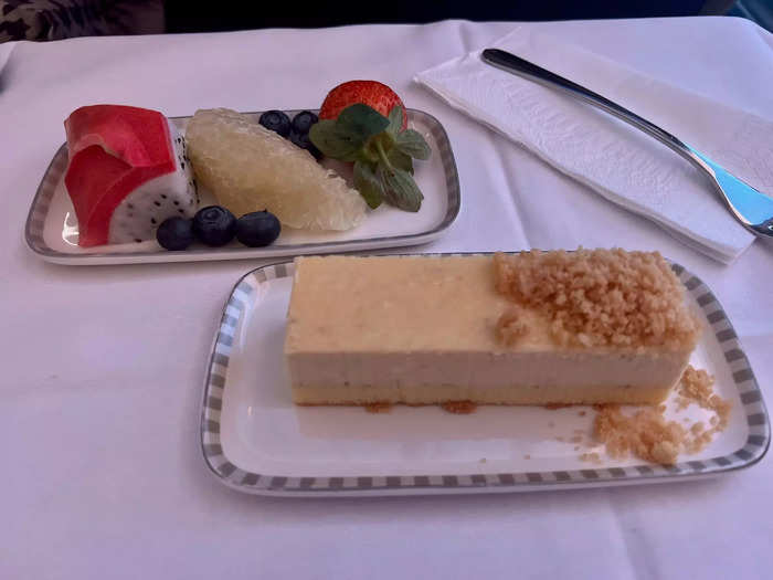 Passengers were also offered more drinks, like beer and soda, as well as several dessert options. I chose the fruit and the cheesecake, which exceeded expectations, especially since dragon fruit was included — my favorite.