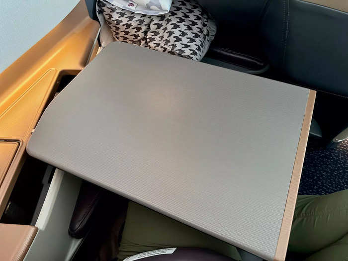 …an adjustable tray table, which can be moved backward, forward, up, and down…