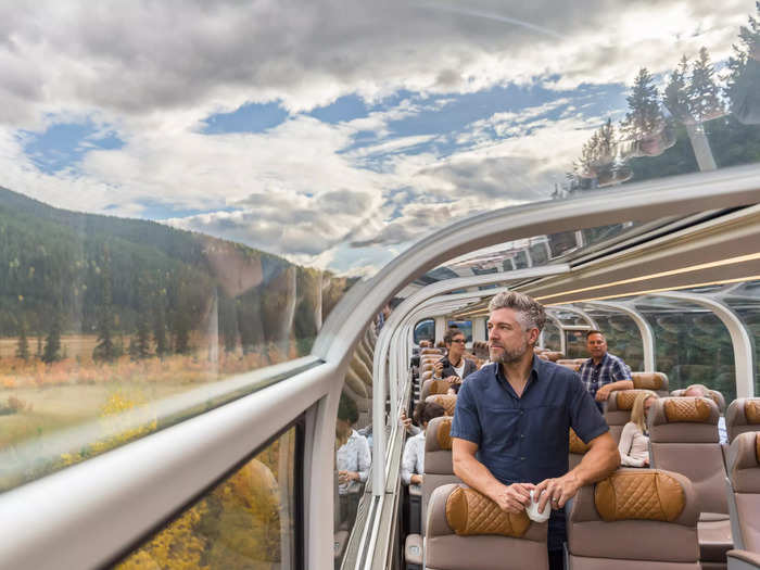 Travelers in the GoldLeaf class onboard the Rocky Mountaineer, which travels through the Canadian Rockies, can relax in a stunning glass-ceiling coach.