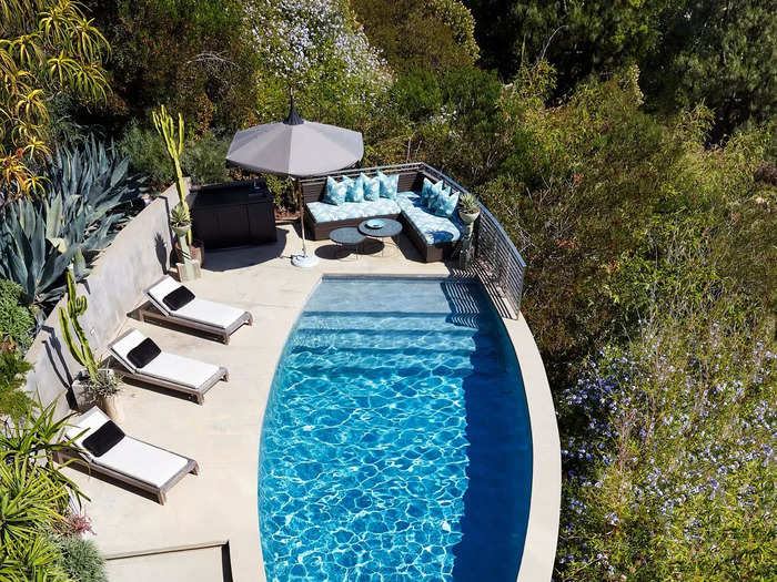 The newest addition to the home is an almond-shaped pool that was added in 2008 and mirrors the home