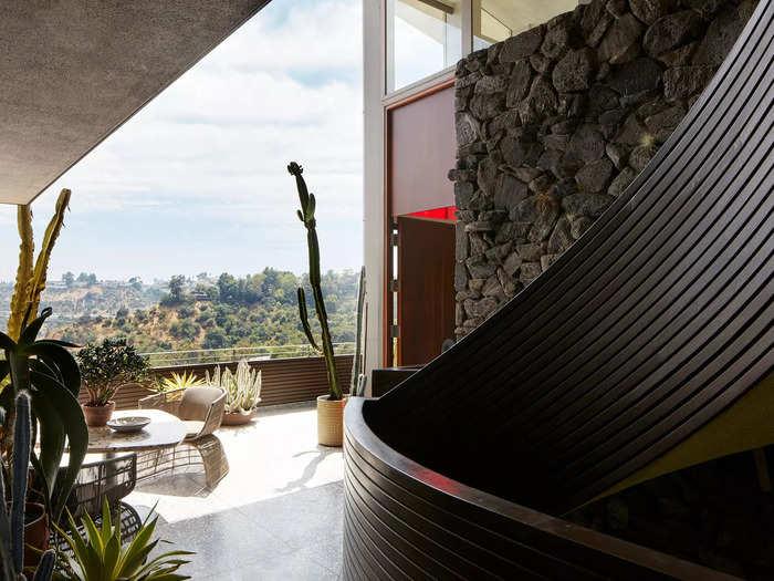 The back terrace of the Garcia house includes a small cactus garden and a curved staircase.