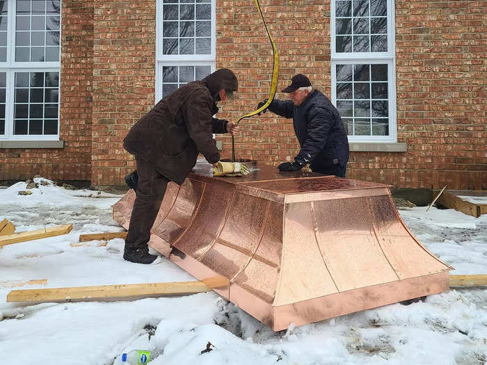 Hébert commissioned costly, bespoke finishes. One of the larger expenses was the copper chimney cap, gutters, and soffits that cost around $140,000.