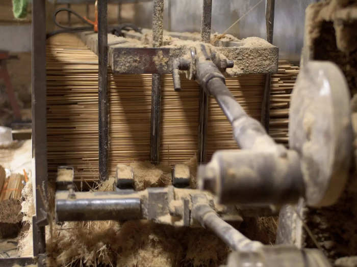 The machine chopper allows thousands of sticks to be shaped in one day. "After chopping," Thi said, "the sticks are sanded and polished, and then cut into the appropriate length to be made into incense sticks."