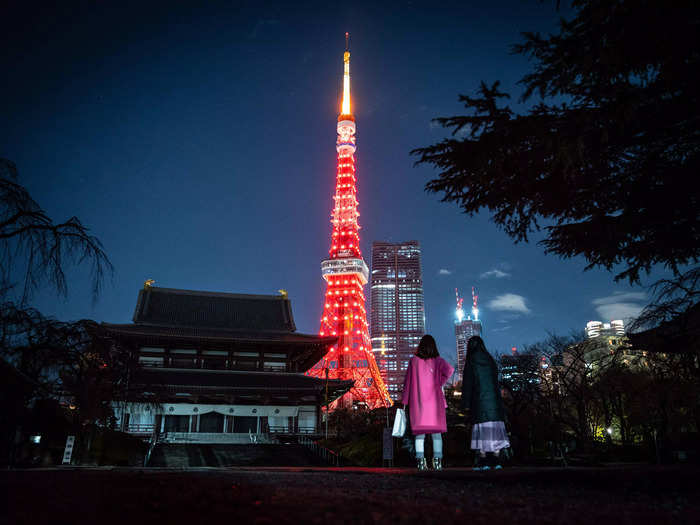 In Tokyo, Japan, members of the public visited Zojoji temple while Tokyo Tower was lit up in bright red in honor of the Lunar New Year.