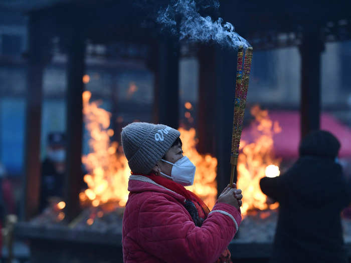 In Fuyang, China, people prayed and burned incense for blessings to celebrate the Lunar New Year.