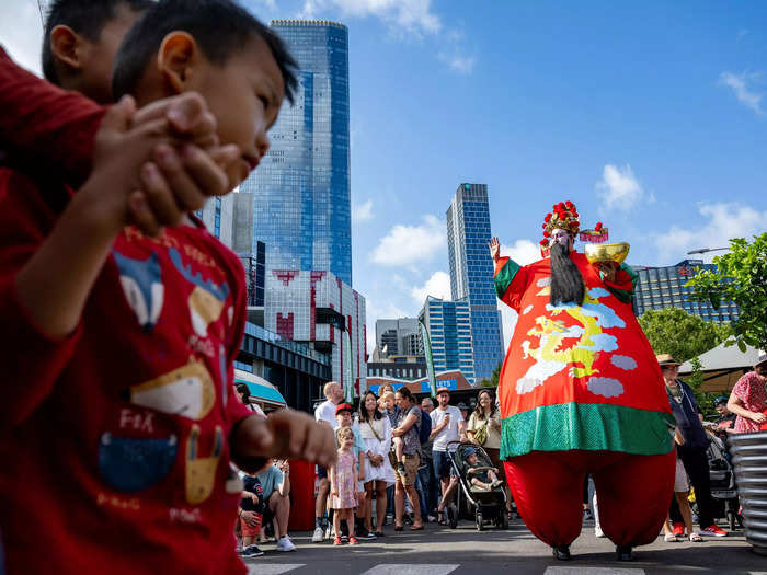 In Melbourne, Australia, crowds gathered at Victoria Market to watch the Vietnamese Buddhist Youth Association parade in costume and perform a dragon dance.