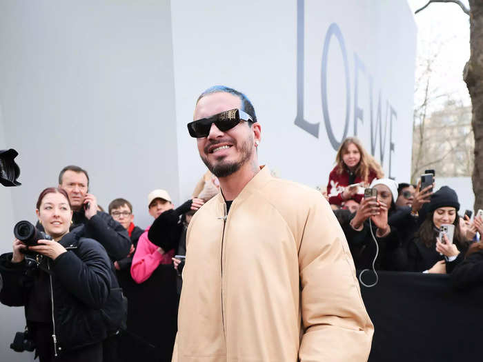 J Balvin arrived at the Loewe show in a sleek jacket.