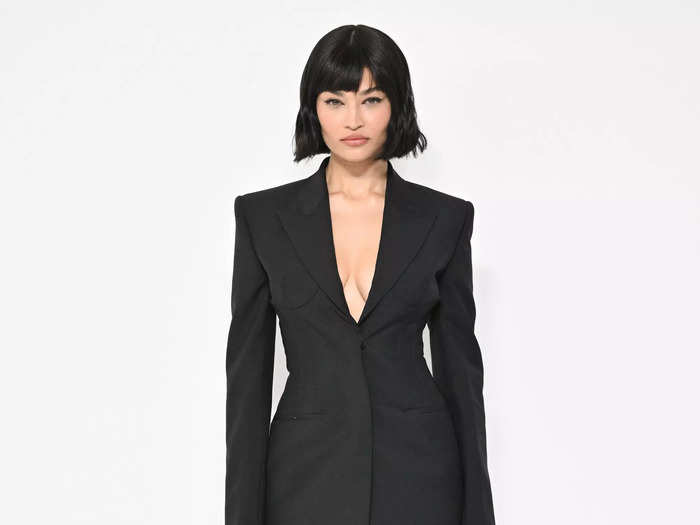 Shanina Shaik wore a bobbed wig and a sleek suit at the Givenchy menswear show.