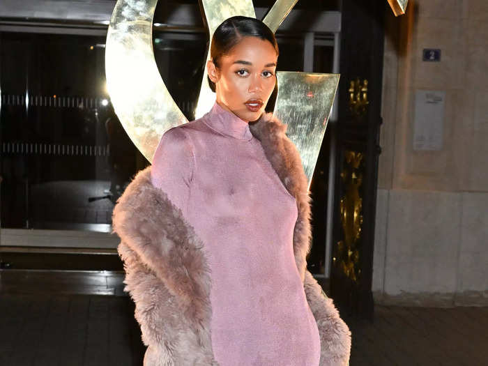 Laura Harrier also opted for a slightly sheer dress, adding a furry coat on top.