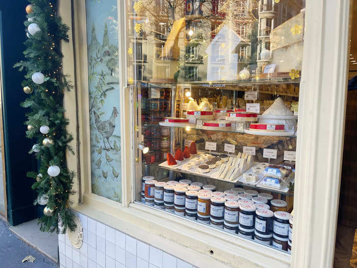 Outside the shop, I could peer in to see a festive window display of different cheeses.