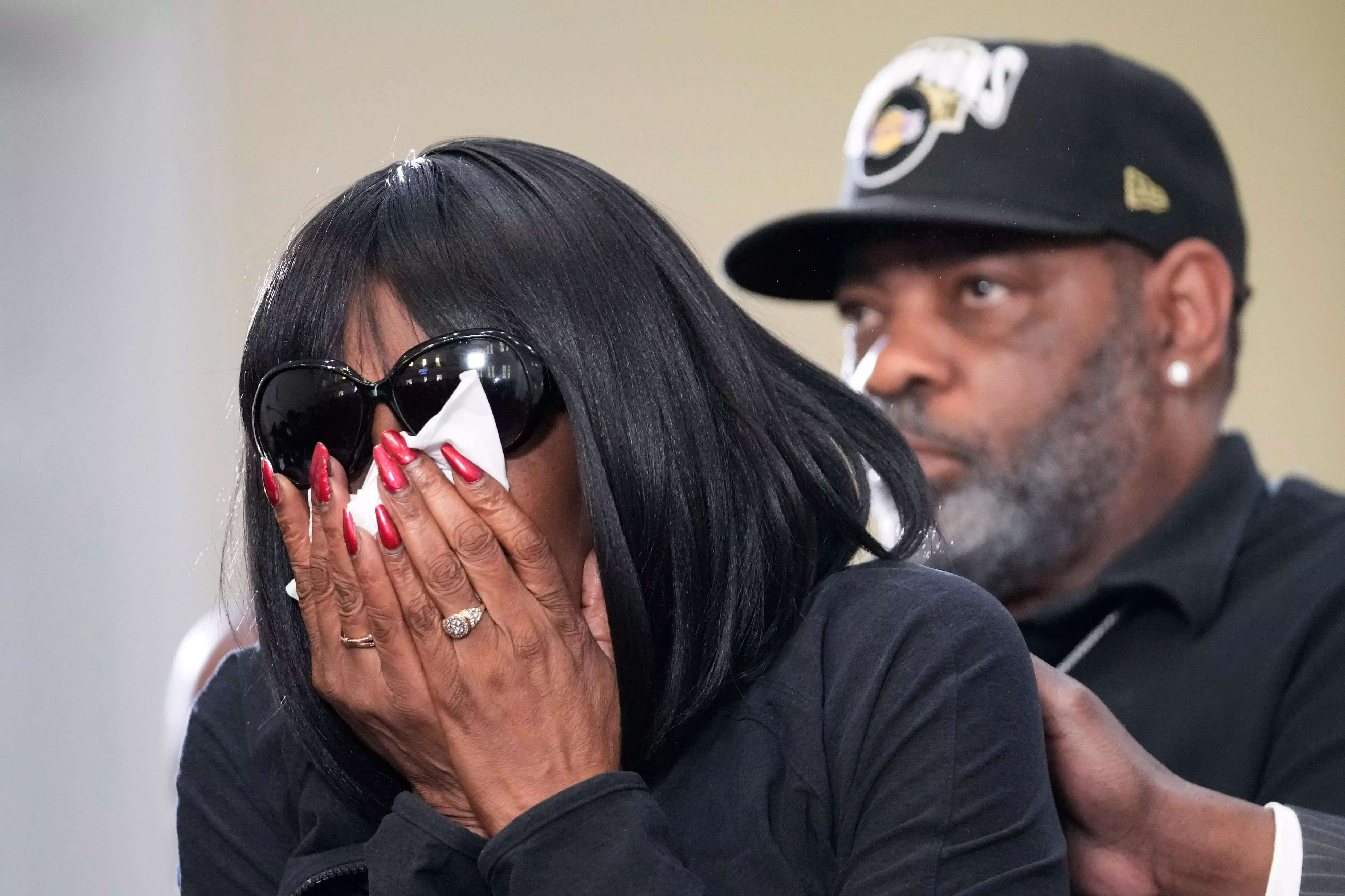 RowVaughn Wells, mother of Tyre Nichols, who died after being beaten by Memphis police officers, cries as she is comforted by Tyre
