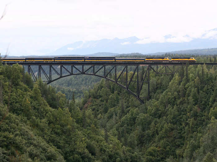 To get to Denali National Park, trains cross a scenic bridge spanning Hurricane Gulch. It was built using more than 100,000 rivets, is 915 feet long, and 296 feet high.