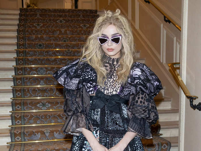 Poppy opted for her signature goth style with a ruffled minidress.