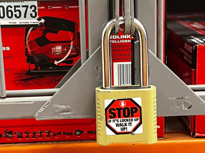 A padlock on a merchandise cage reminded store workers at Home Depot to personally bring items to the checkout.