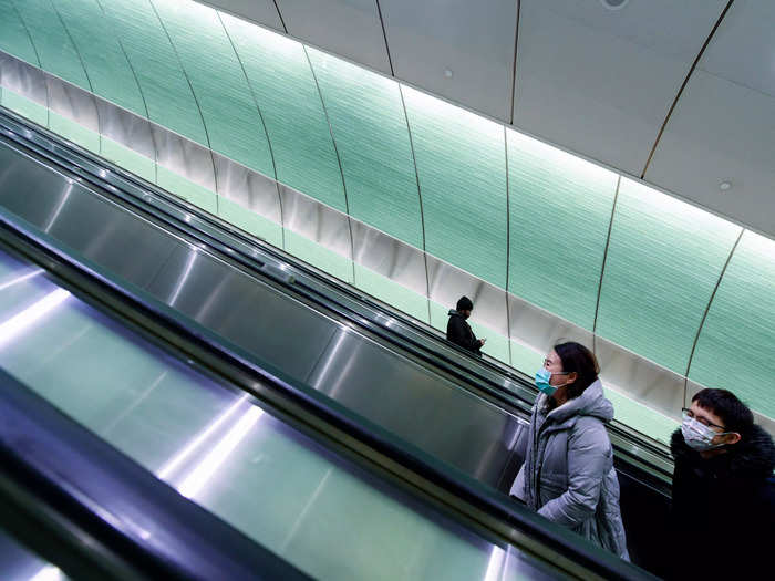 Travelers trek up and down the long escalator to Grand Central Madison, marking a new era for the LIRR.