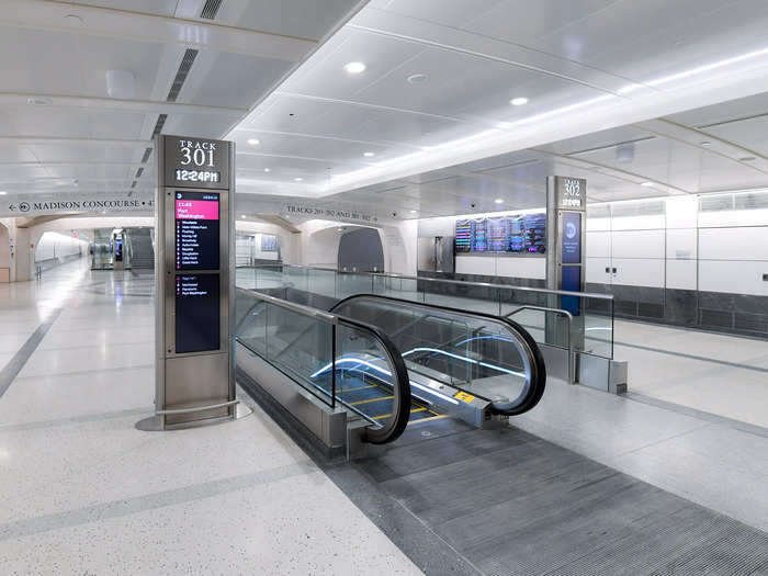 A photo of the same platform entrance shows the results of the finishing touches just before the terminal opened Wednesday to the public and welcomed its first passengers.