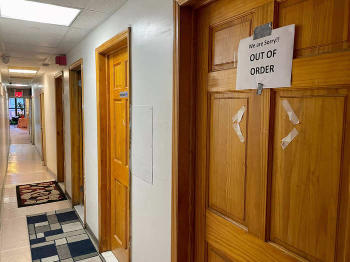 I followed signs leading down the hallway away from the lobby, and looped around into a new hallway with several shared bathrooms.