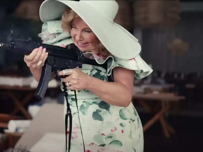 Jennifer Coolidge uses a machine gun in "Shotgun Wedding."