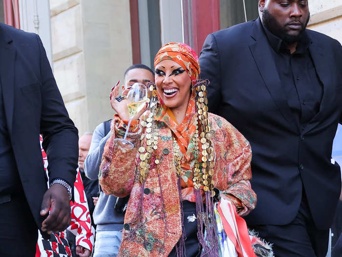 That same week, Doja Cat stepped to the Vivienne Westwood womenswear show in colorful layers of fabric and a matching head scarf.