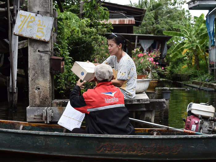 People on the outskirts of Bangkok, Thailand, also sometimes receive deliveries by boat.