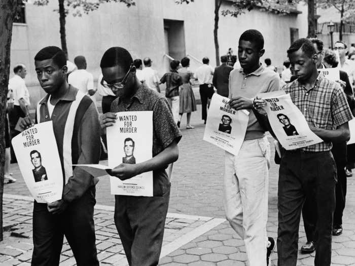 A crowd of people gathered outside the police precinct calling for Gilligan