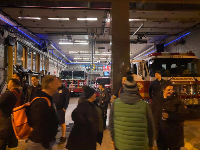 A group of firemen stood outside their station to take in the action.