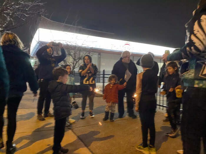 At one intersection, a young group of Eagles fans sang the fight song as they played with sparklers.