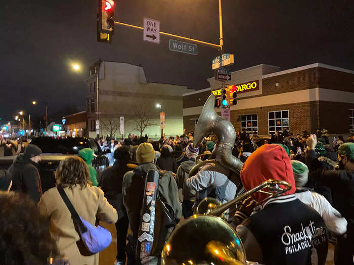 The band was "Snacktime" and their horns led the way through the streets a group of fans heading north.