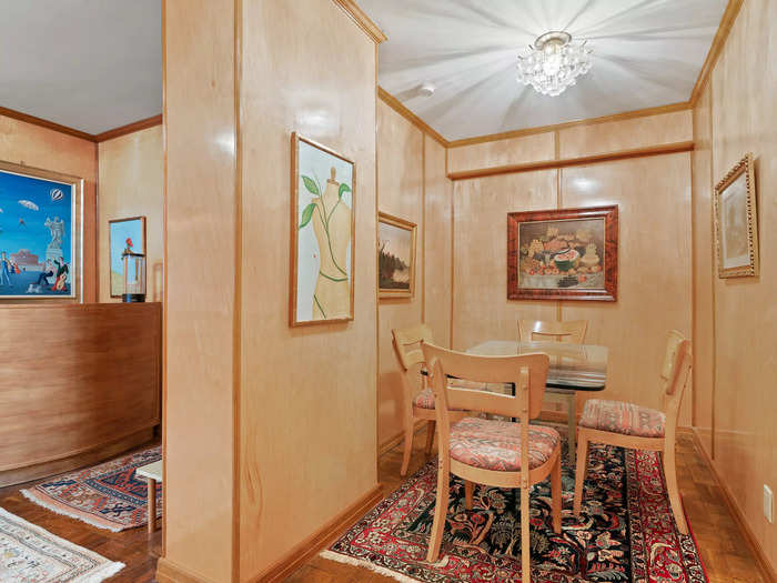 The walls of the 1,135-square-foot apartment are almost entirely covered in maple plywood panels.