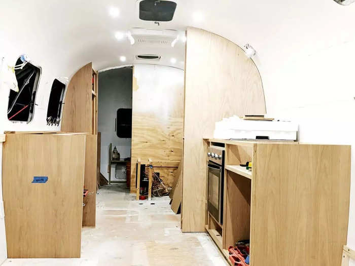 The couple built all the cabinets and partition walls on their own, relying on information gathered from tiny living and vehicle conversion forums online.