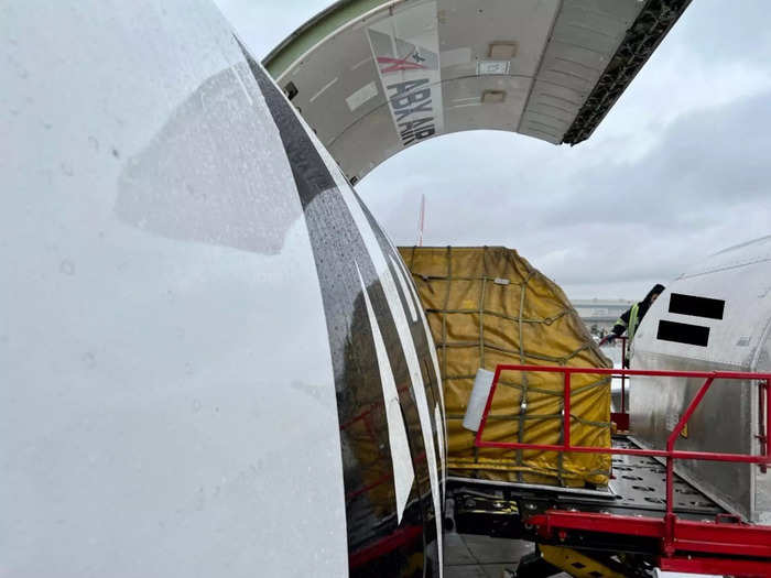 Loading is a similar process to unloading — containers will be raised on a platform, moved into the jet via one of the three doors, and organized inside.