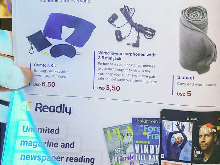 In my seat back pocket, there was a menu of amenities including earbuds, blankets, neck pillows, and sleep masks, although I didn