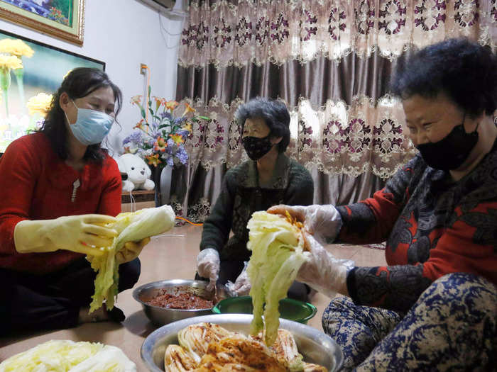 Still, they enjoy traditions with their neighbors, like making kimchi.