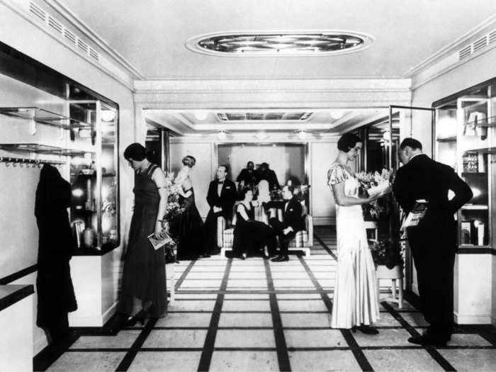 Not that they disappeared completely. Here is a first-class lobby of a German ocean liner called the Caribia. Note the guests