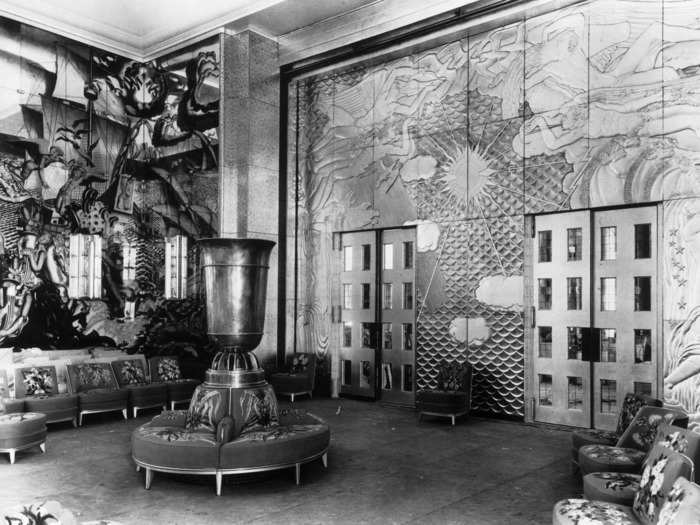 As the industry developed, details on the ships continued to evoke beautiful hotels. Here, an art deco door separates the smoking room and the grand saloon of a French liner called Normandie.