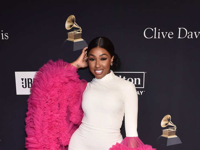 Yung Miami rocked a white bodycon dress with voluminous tulle sleeves.