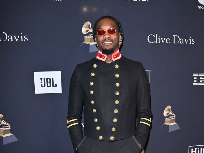 Offset put his twist on formalwear with a military-style jacket and red sunglasses.