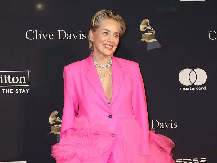 Sharon Stone donned a dramatic ruffled suit in bright pink.