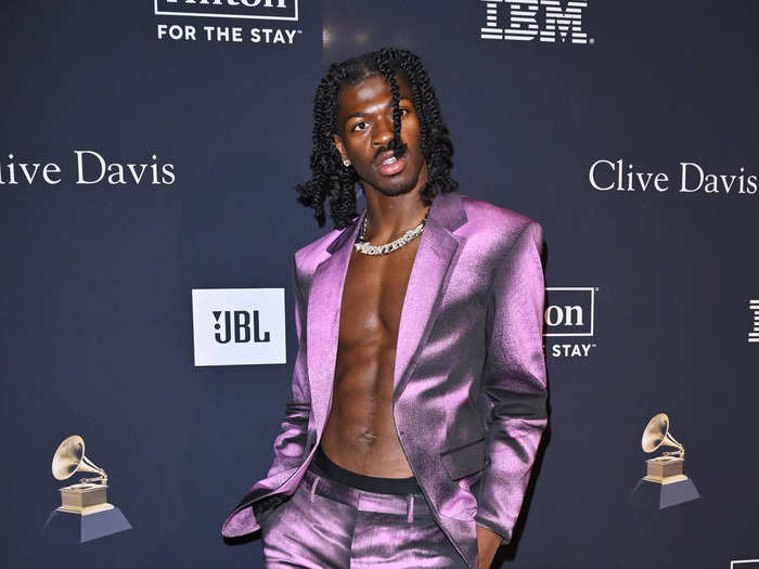 A shirtless Lil Nas X made a statement in a graphic purple suit.