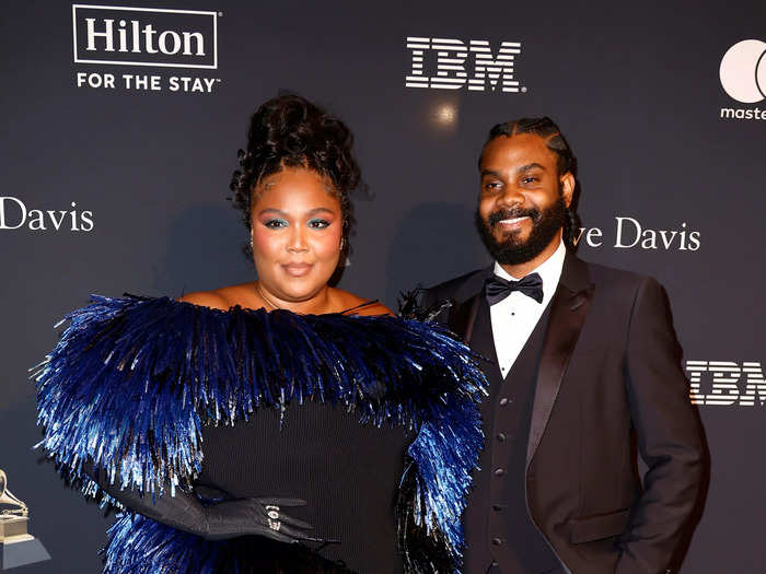 Lizzo was joined by her boyfriend Myke Wright on the red carpet, but she stood out in a flouncy minidress with feathers.