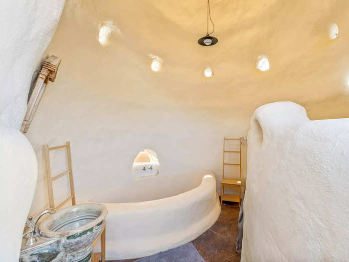 The domes include built-in features, such as bathtubs and display shelves.