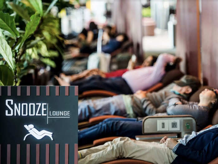 …and the designated free-to-use "sleep zones," which have lay flat loungers and pods. These make long layovers — and even multi-hour delays and overnight cancellations — more bearable.