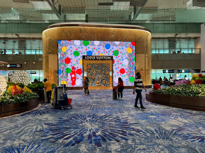 Once inside, I was immediately taken away by the sheer size of the terminal. All of the beautiful lights and stores impressed me, especially Louis Vuitton — one of three in Changi.