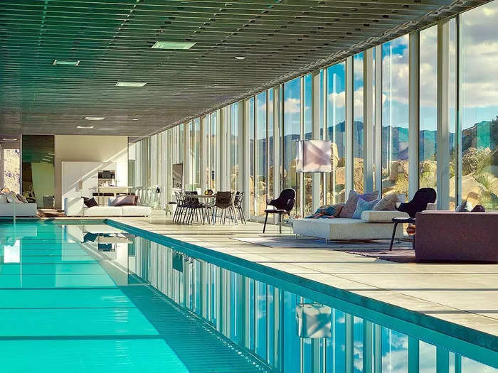 This reflective glass home with an indoor pool lets guests blend in with the Californian desert.