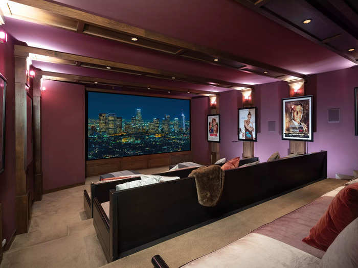 The lower level of the home includes a 30-person theater adorned with posters of Jennifer Lopez and her husband Ben Affleck from films they