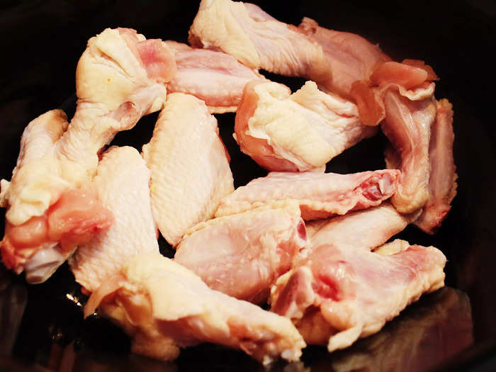 When you buy your chicken wings, make sure the drumsticks and flats are separated and ready to add to your slow cooker.