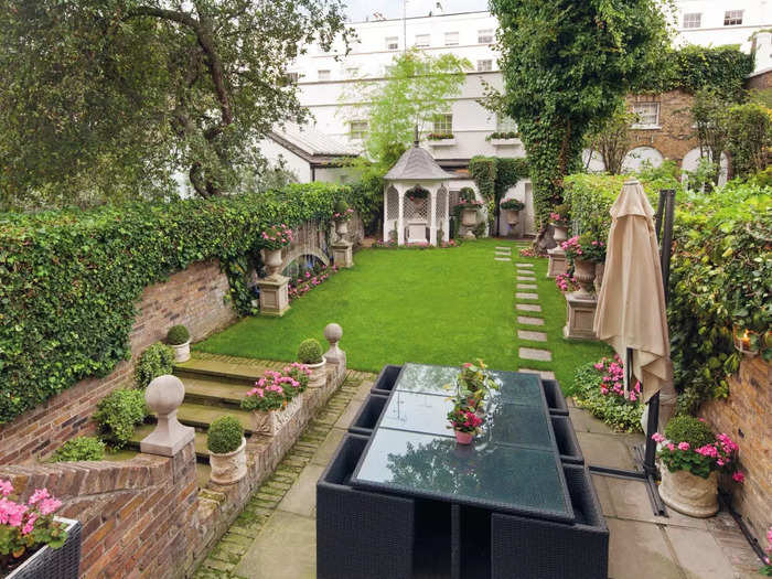 The private garden leads to a separate mews house.