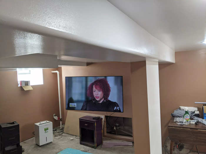 He added a TV as well as a mini fridge hoping family could stay in the basement when visiting.