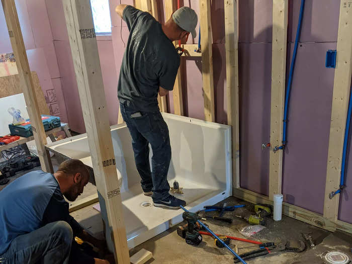 His friends also helped install the shower and toilet.